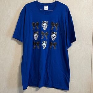 NWOT Blue Graphic T-Shirt with Skull and Bow Design